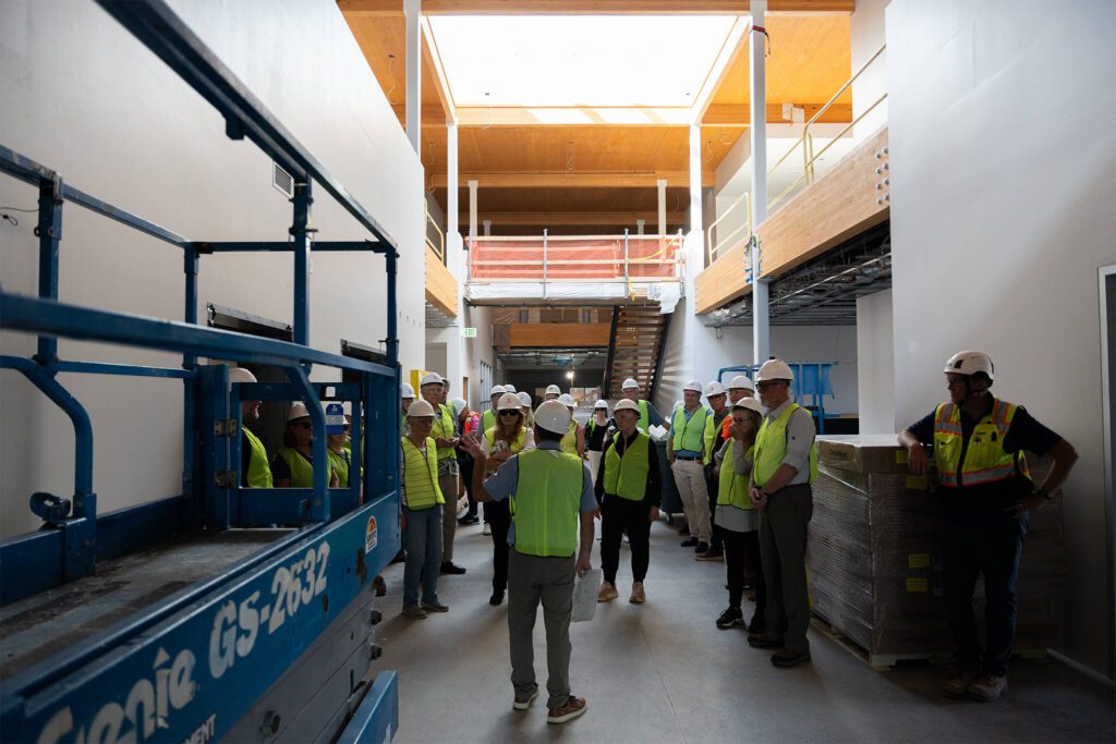 Members of local Rotary clubs tour the Lynnwood Neighborhood Center on Thursday, Aug. 14 in Lynnwood, Washington. (Will Geschke / The Herald)
