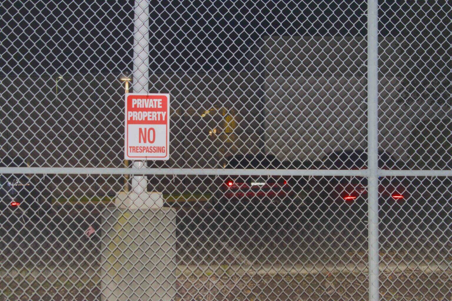 A ‘no trespassing’ sign on a fence outside the Northwest ICE Processing Center. (Photo by Grace Deng/Washington State Standard)