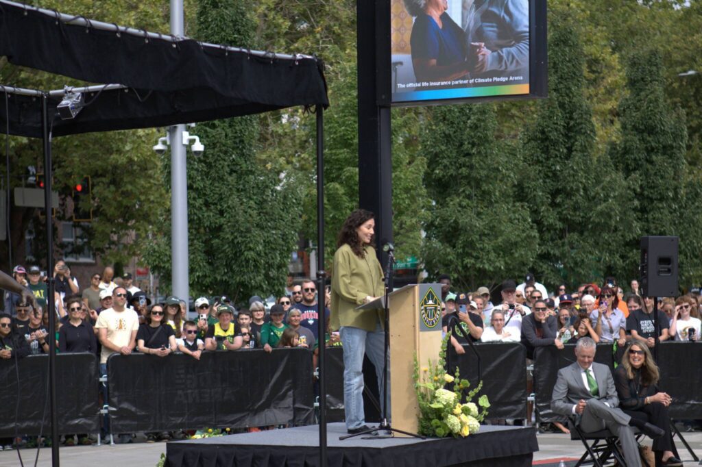 Seattle Storm Hall-of-Famer Sue Bird delivers a speech during her statue unveiling on Sunday, Aug. 17, 2025 outside of Climate Pledge Arena in Seattle. (Qasim Ali / The Herald)

