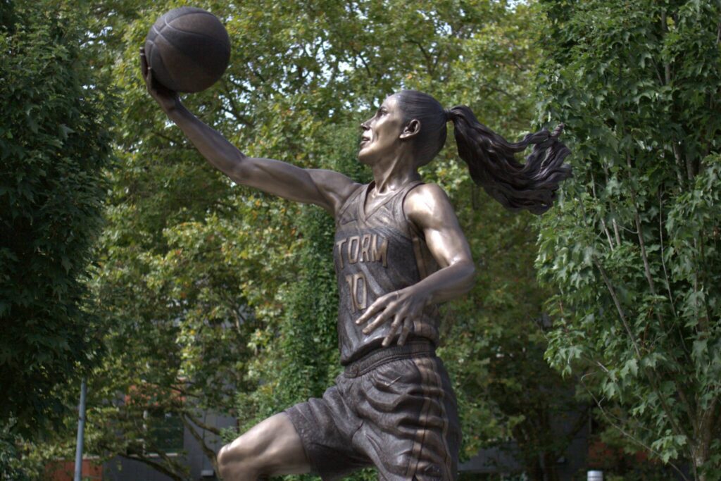 Seattle Storm Hall-of-Famer Sue Bird’s statue shortly after its unveiling on Sunday, Aug. 17, 2025 outside of Climate Pledge Arena in Seattle. (Qasim Ali / The Herald)
