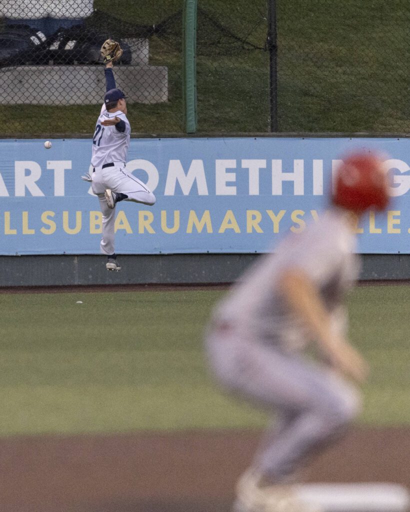 Everett AquaSox outfielder Anthony Donofrio leaps in the air to try and catch a ball hit to the outfield during the game against the Spokane Indians on Tuesday, Aug. 19, 2025 in Everett, Washington. (Olivia Vanni / The Herald)
