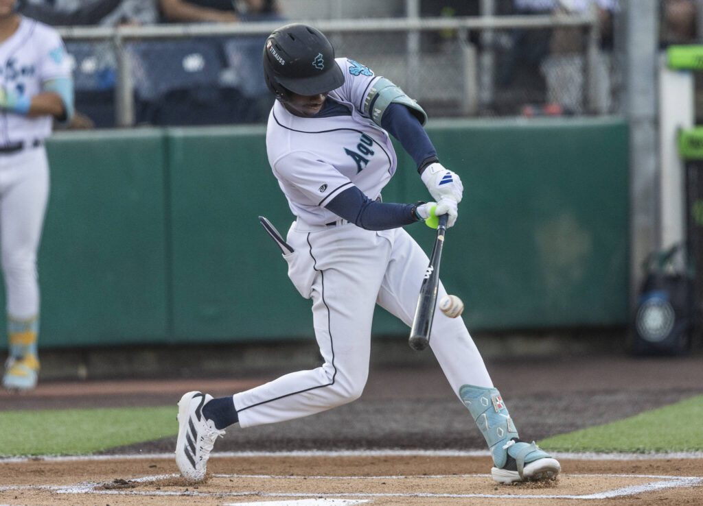 Everett AquaSox infielder Felnin Celesten makes contact with the ball during an at bat during the game against the Spokane Indians on Tuesday, Aug. 19, 2025 in Everett, Washington. (Olivia Vanni / The Herald)
