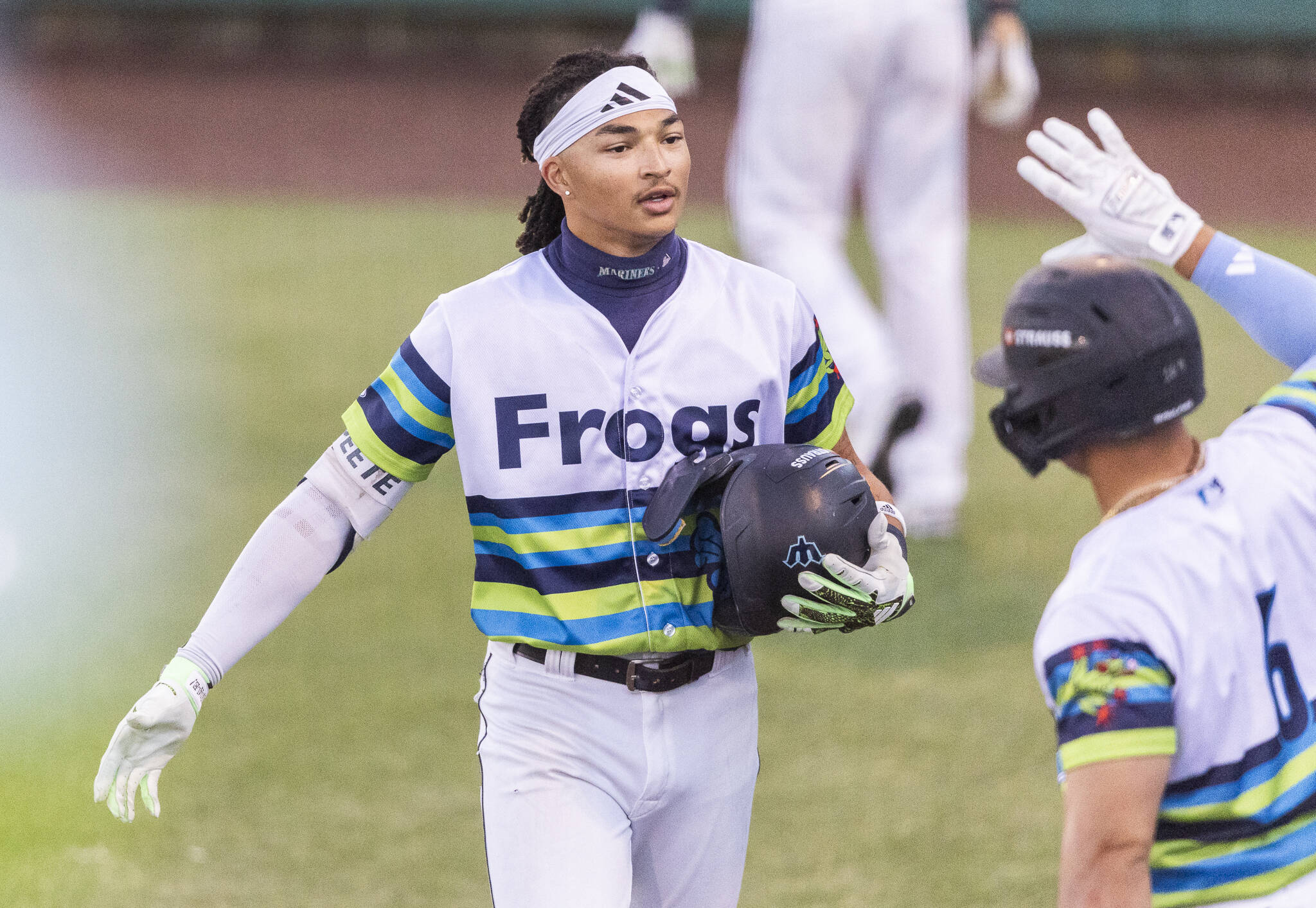 Everett AquaSox outfielder Tai Peete high-fives his teammates after hitting a home run during the game against the Spokane Indians on Wednesday, Aug. 20, 2025 in Everett, Washington. (Olivia Vanni / The Herald)