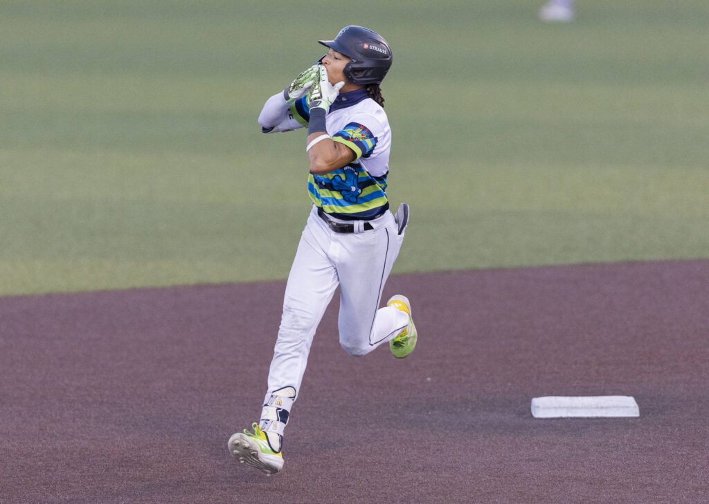 Everett AquaSox outfielder Tai Peete blows a kiss to the outfield as he runs the bases after hitting a home run during the game against the Spokane Indians on Wednesday, Aug. 20, 2025 in Everett, Washington. (Olivia Vanni / The Herald)

