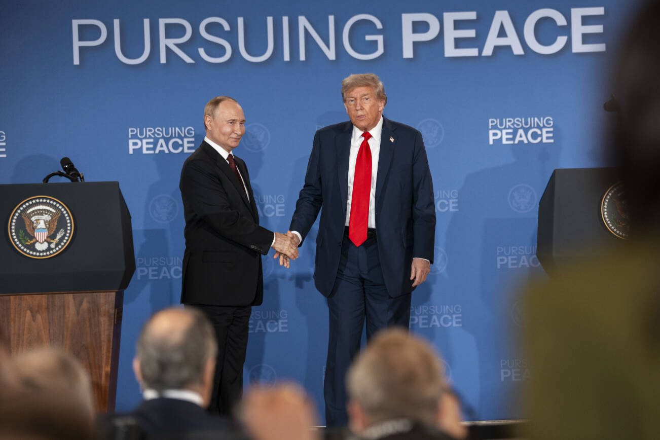 Russian President Vladimir Putin and President Donald Trump shake hands after a joint news conference following their meeting in Anchorage, Alaska, Aug. 15, 2025. Amid the setbacks for Ukraine from the meeting in Alaska, officials in Kyiv seized on one glimmer of hope — a U.S. proposal to include security guarantees for Ukraine in any potential peace deal with Russia. (Doug Mills/The New York Times)