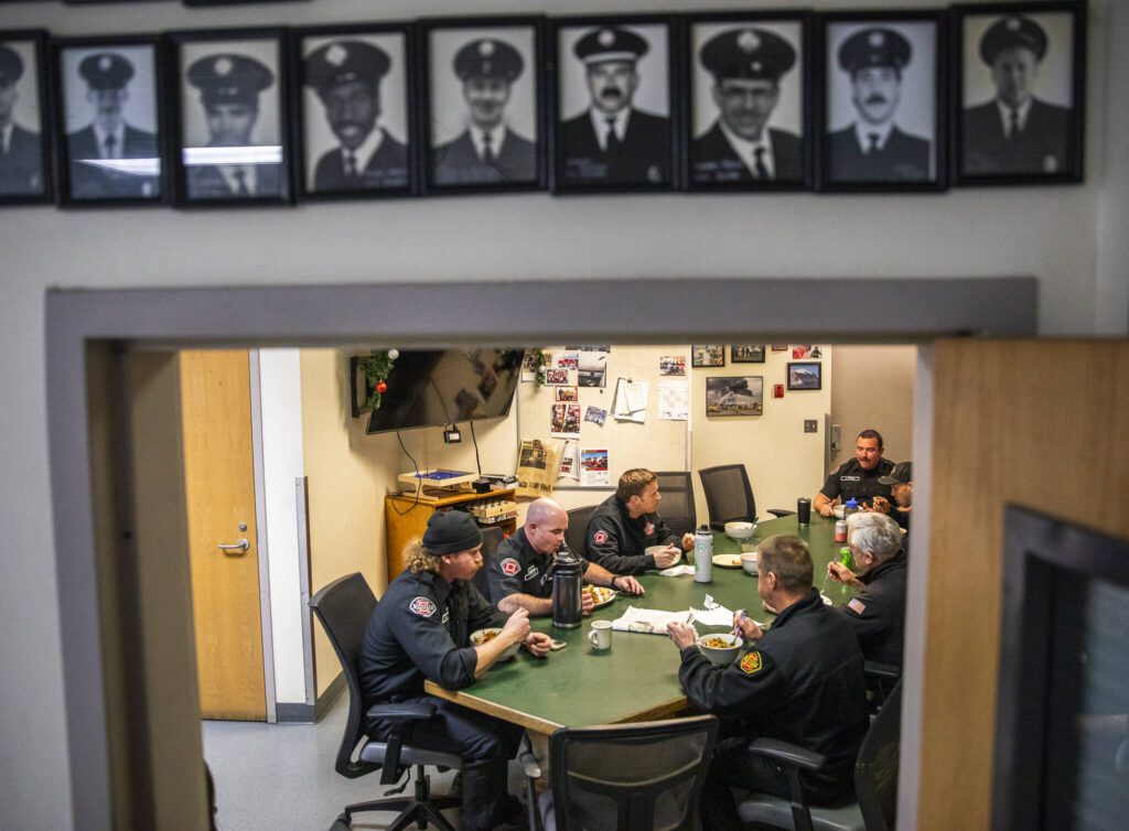 Everett Fire Station One firefighters gather for dinner. (Olivia Vanni / The Herald)
Everett Fire Station One firefighters gather for dinner. (Olivia Vanni / The Herald)
