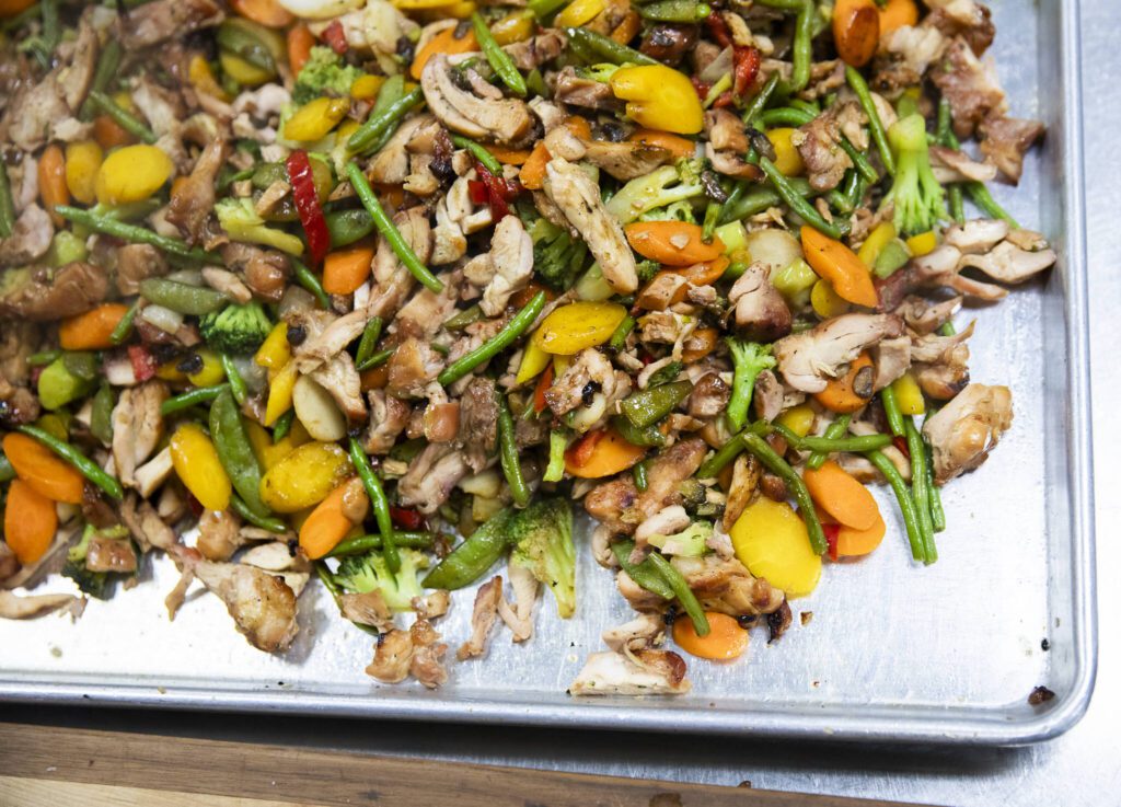 Chicken stir-fry and vegetables steaming on a serving tray. (Olivia Vanni / The Herald)
Chicken stir-fry and vegetables steaming on a serving tray. (Olivia Vanni / The Herald)
