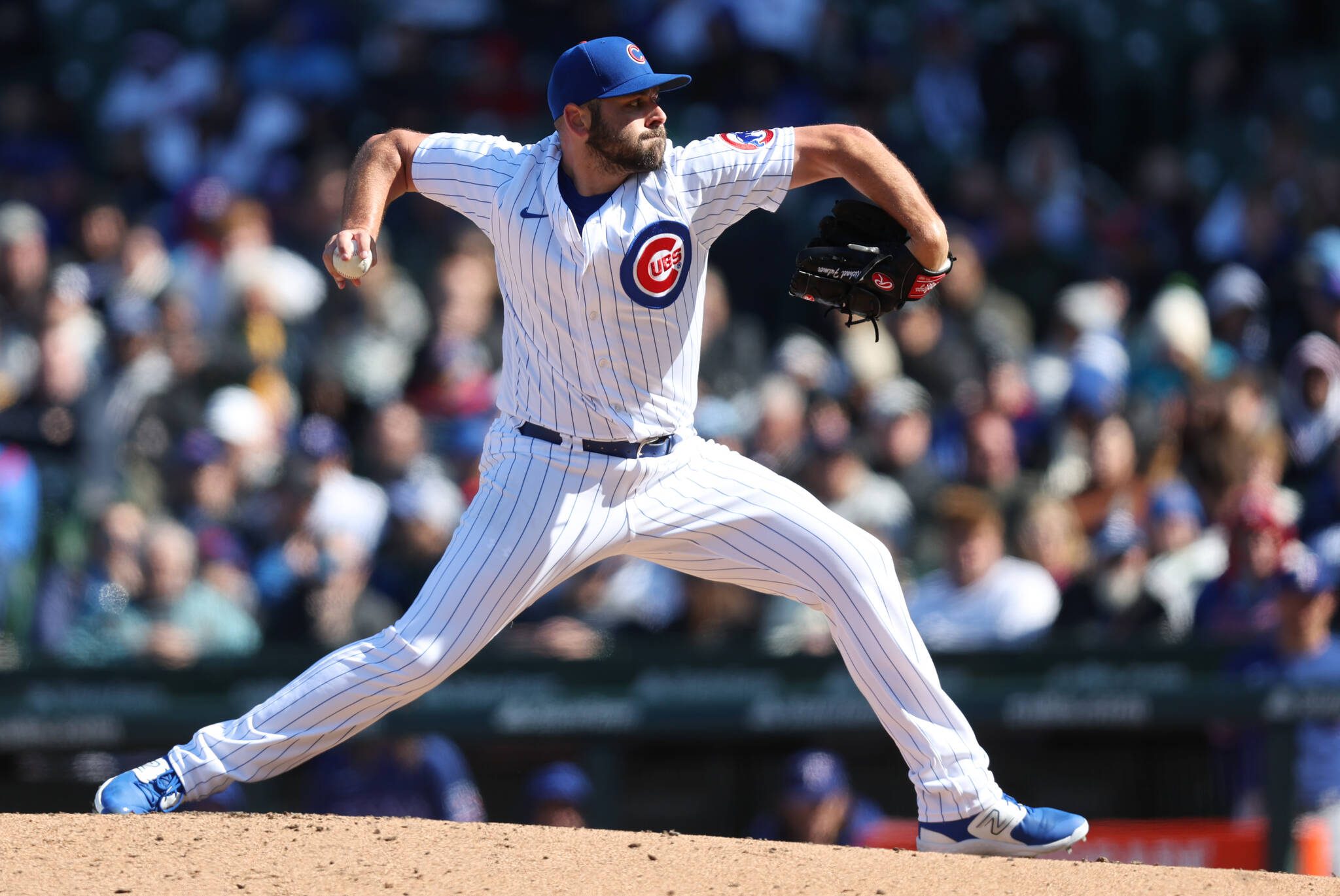 Chicago Cubs relief pitcher Michael Fulmer (32) delivers to the Texas Rangers in the 8th inning of a game at Wrigley Field in Chicago on Friday, April 7, 2023.  (Chris Sweda / Chicago Tribune / Tribune News Services)