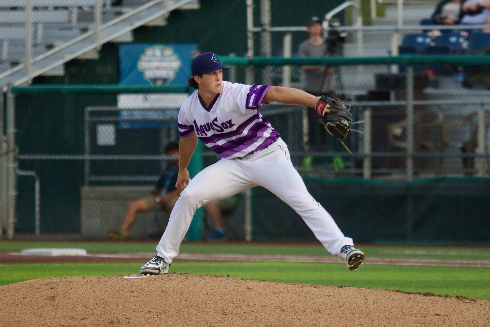 AquaSox pitcher Ryan Sloan winds up for a pitch in Everett’s 4-3 loss to the Spokane Indians at Funko Field on Aug. 23, 2025. (Joe Pohoryles / The Herald)