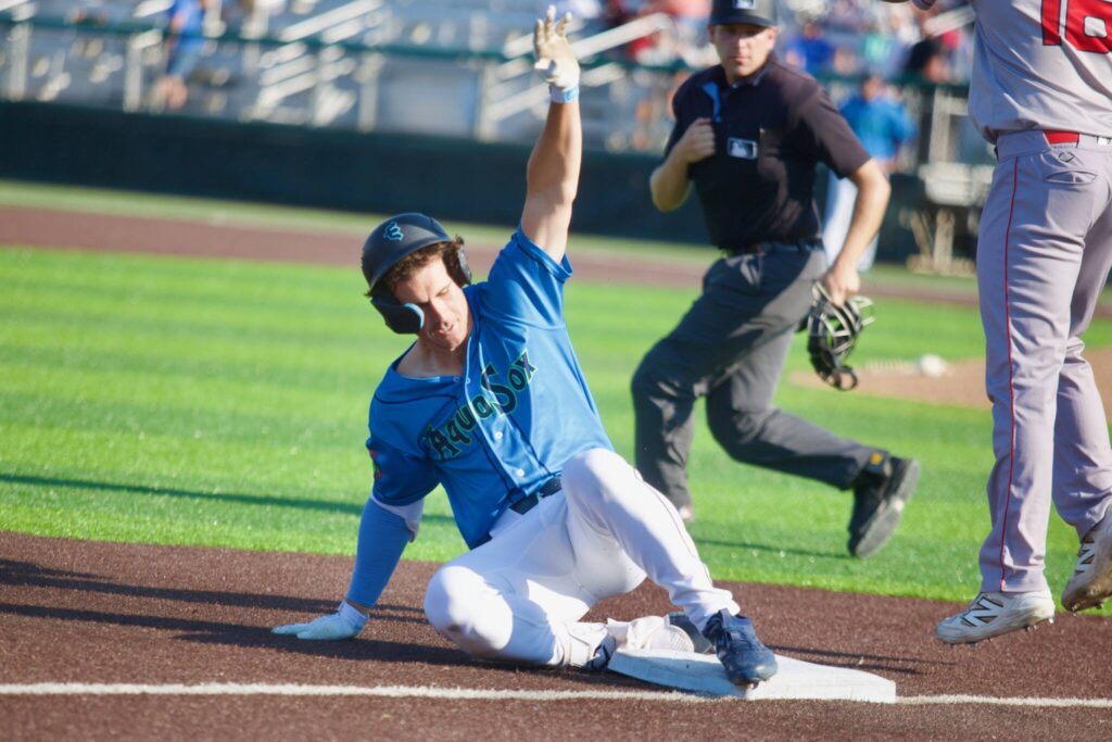 AquaSox infielder Charlie Pagliarini slides into third base after hitting a triple in Everett&rsquo;s 5-1 loss to the Spokane Indians at Funko Field on Aug. 24, 2025. (Joe Pohoryles / The Herald)

