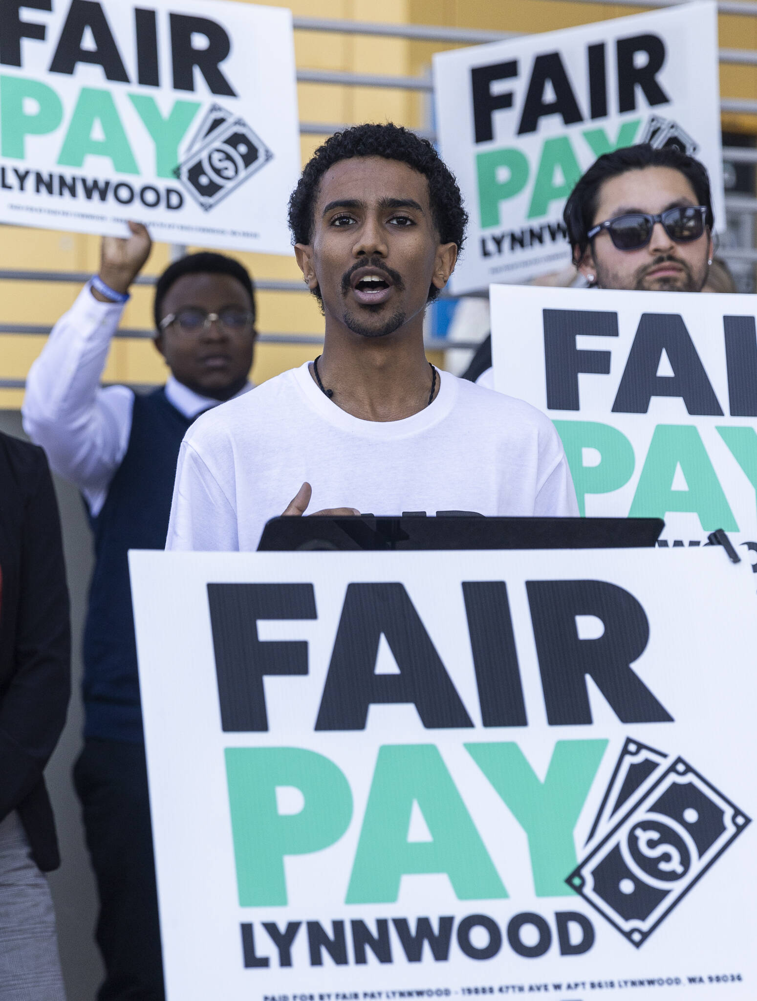 Jacob Feleke speaks during a Fair Pay Lynnwood rally at the Lynnwood Light Rail Station on Monday, Aug. 25, 2025, in Lynnwood, Washington. (Olivia Vanni / The Herald)