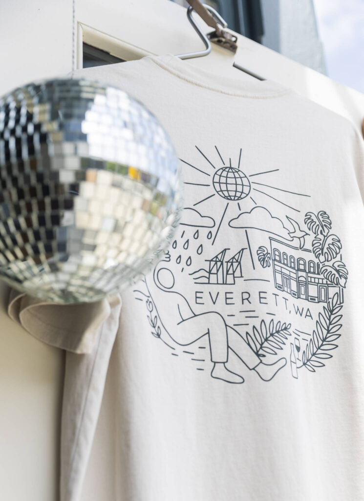 A T-shirt that Aaron Sheckler and Scott Hulme designed on display at Petrikor on Thursday, July 31, 2025 in Everett, Washington. (Olivia Vanni / The Herald)
