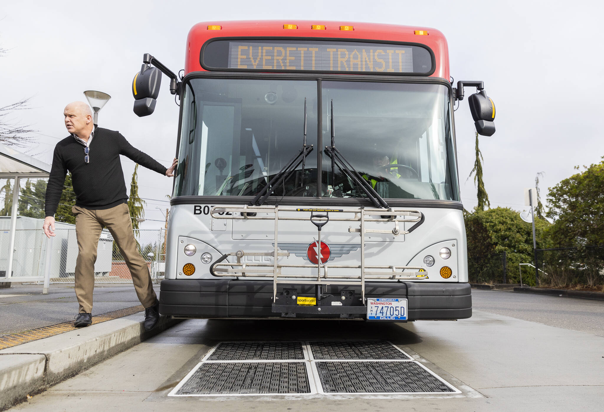 Everett Transit Director Mike Schmieder talks about how the buses are able to lower themselves onto the induction chargers on Monday, March 10, 2025, in Everett, Washington. (Olivia Vanni / The Herald)