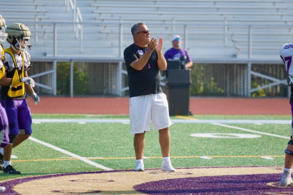 Lake Stevens football coach Tom Tri addresses the team during a practice at Lake Stevens High School on Sept. 2, 2025. (Joe Pohoryles / The Herald)