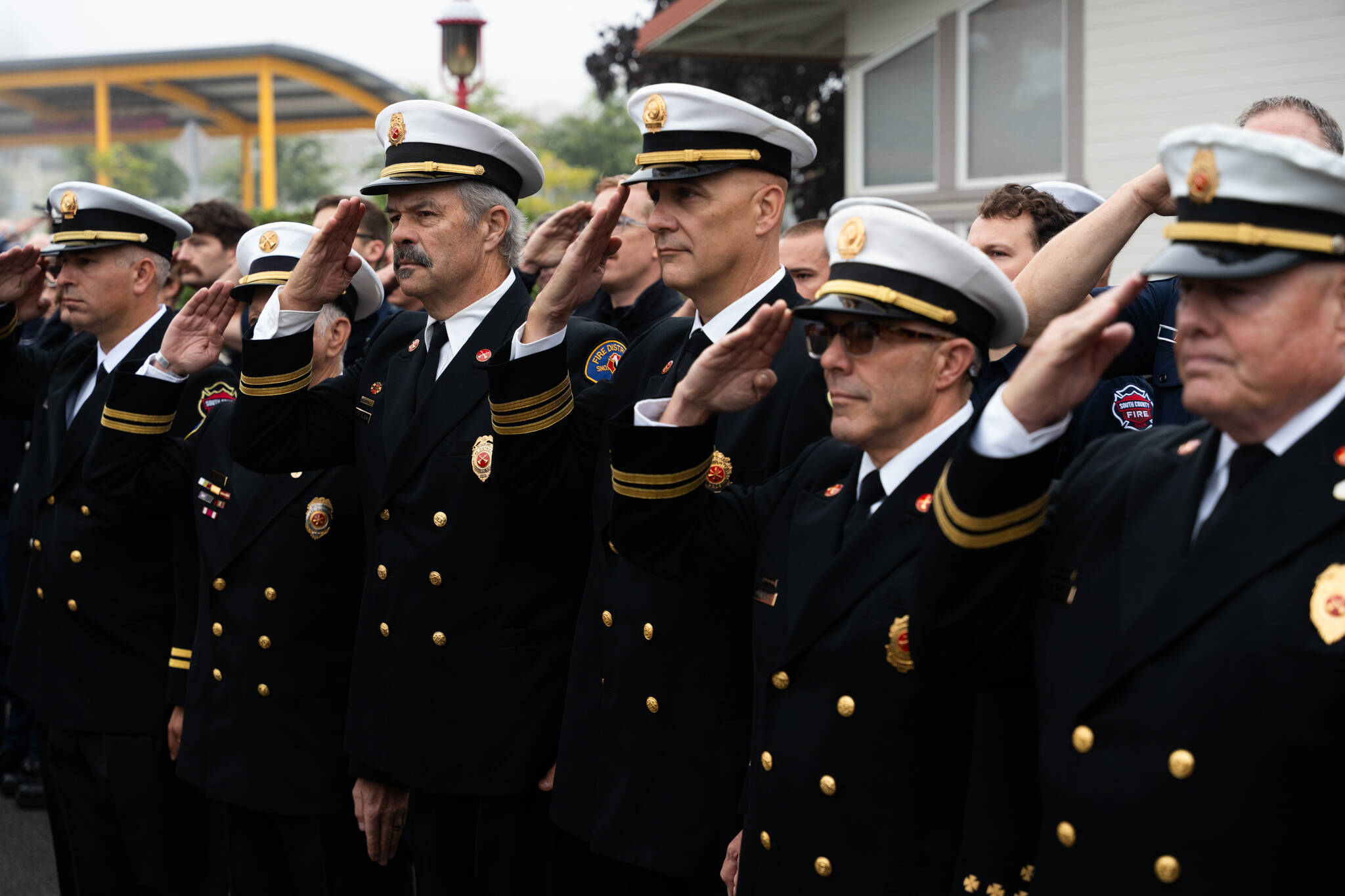South County Fire firefighters salute the American flag during a commemoration of the 24th anniversary of the Sept. 11, 2001 attacks on Thursday, Sept. 11, 2025, in Edmonds, Washington. (Will Geschke / The Herald)