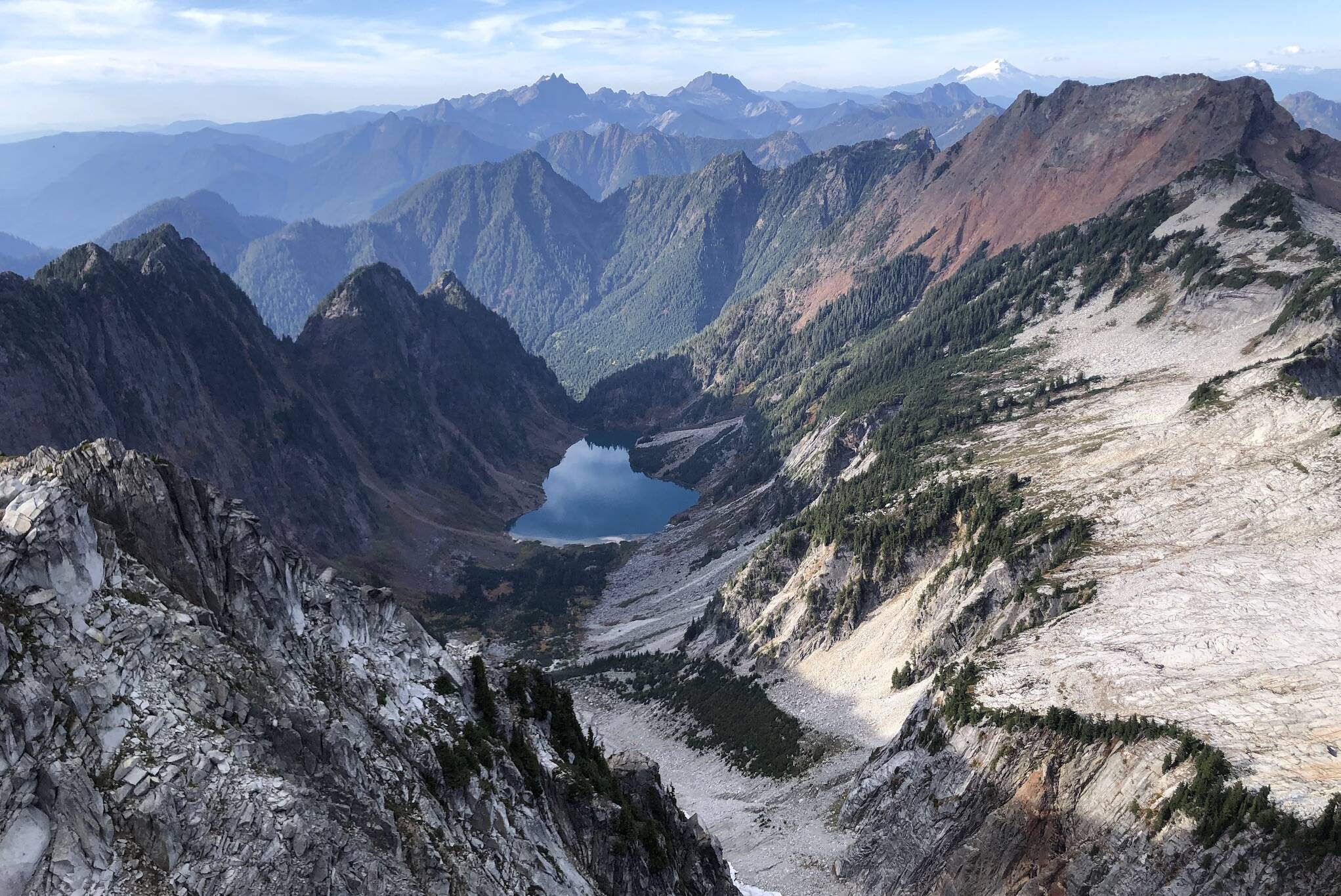 Copper Lake as seen from Vesper Peak on Oct. 8, 2023. A helicopter trying to land on the south end of the lake — the nearest shoreline in the image — crashed into the water in early September, where it remained weeks later. (Caleb Hutton / The Herald)