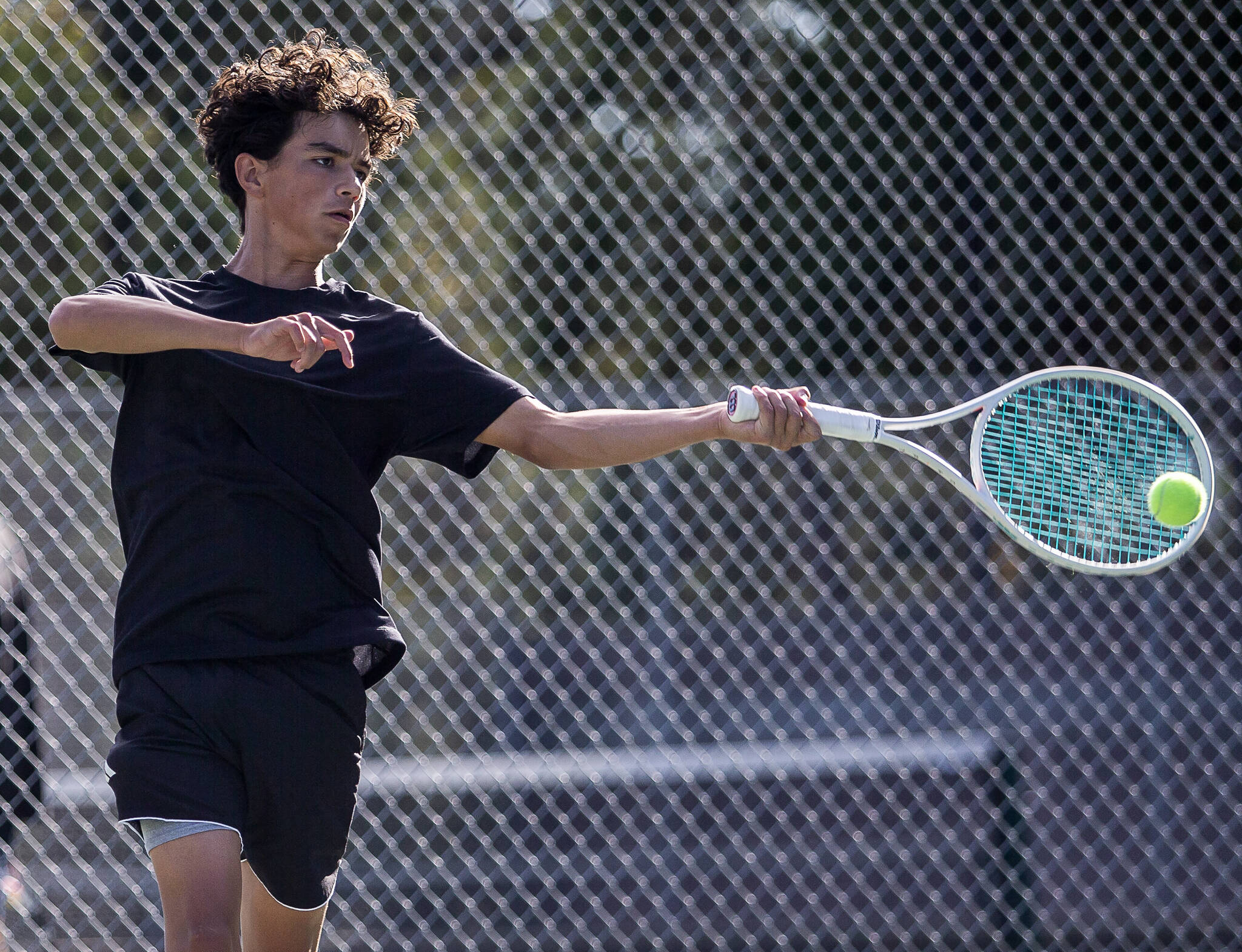 Kamiak’s Levi Seslar hits the ball during a double match against Jackson on Monday, Sept. 30, 2024 in Mill Creek, Washington. (Olivia Vanni / The Herald)