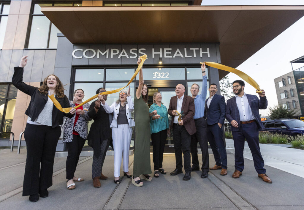 Compass Health officials and community members cut a ribbon outside of the new Marc Healing Center on Wednesday, Sept. 17, 2025 in Everett, Washington. (Olivia Vanni / The Herald)
