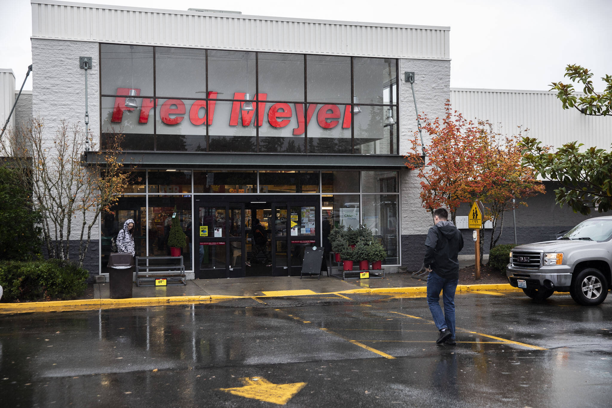 Customers walk in and out of Fred Meyer along Evergreen Way in 2022 in Everett. (Olivia Vanni / The Herald)
