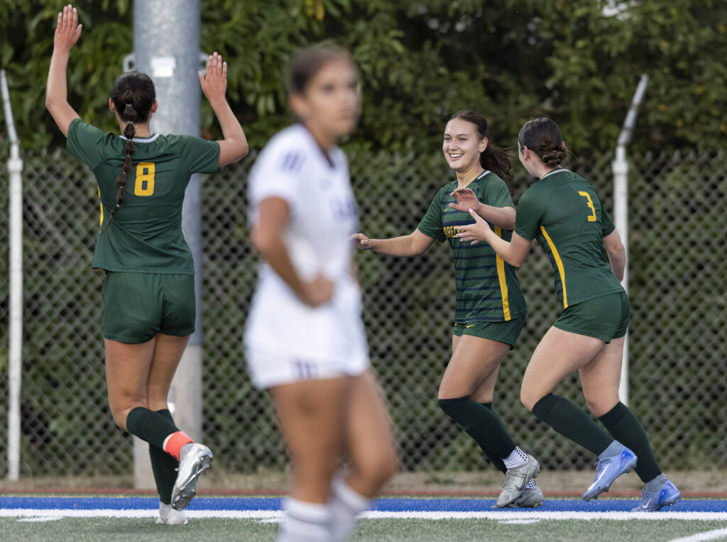 Shorecrest’s Olivia Taylor celebrates with her teammates after scoring a goal during the game against Lake Stevens on Thursday, Sept. 18, 2025 in Shoreline, Washington. (Olivia Vanni / The Herald)
