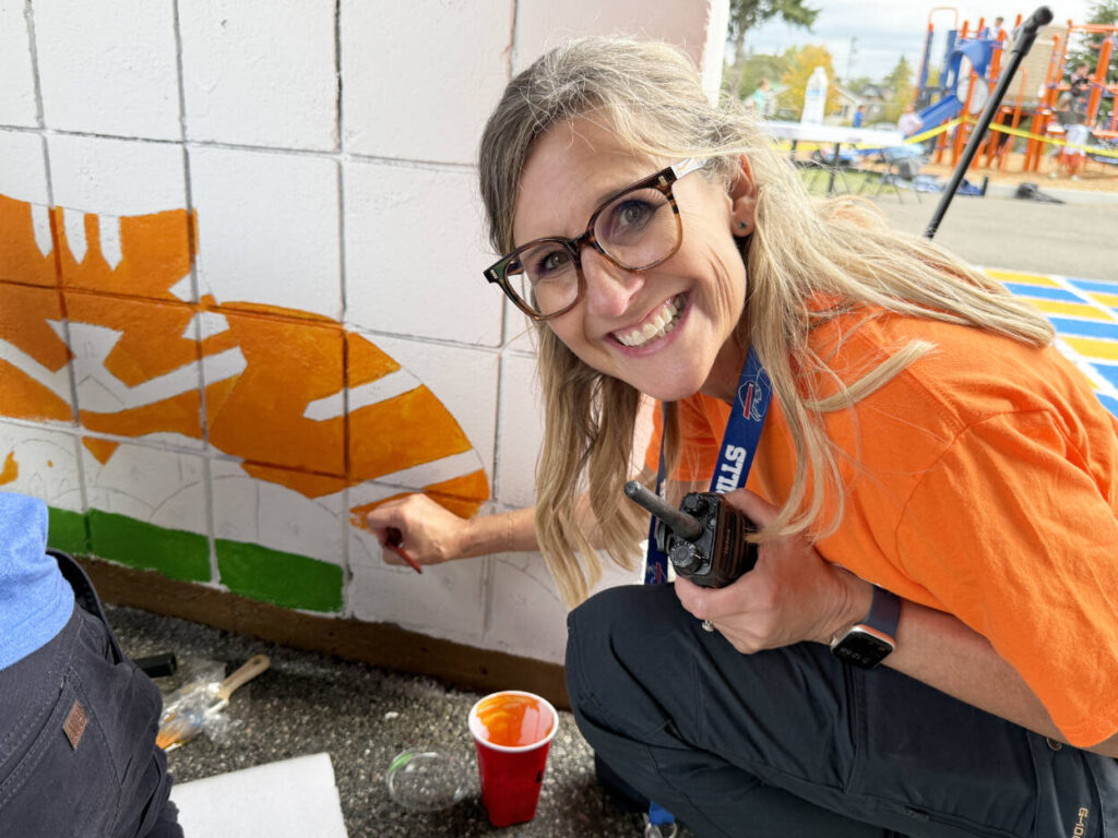 More than 90 volunteers helped paint graphics on the Garfield Elementary School playground and inside the gym and built decorative paw prints on Sept. 12 in Everett. (Photo provided)
