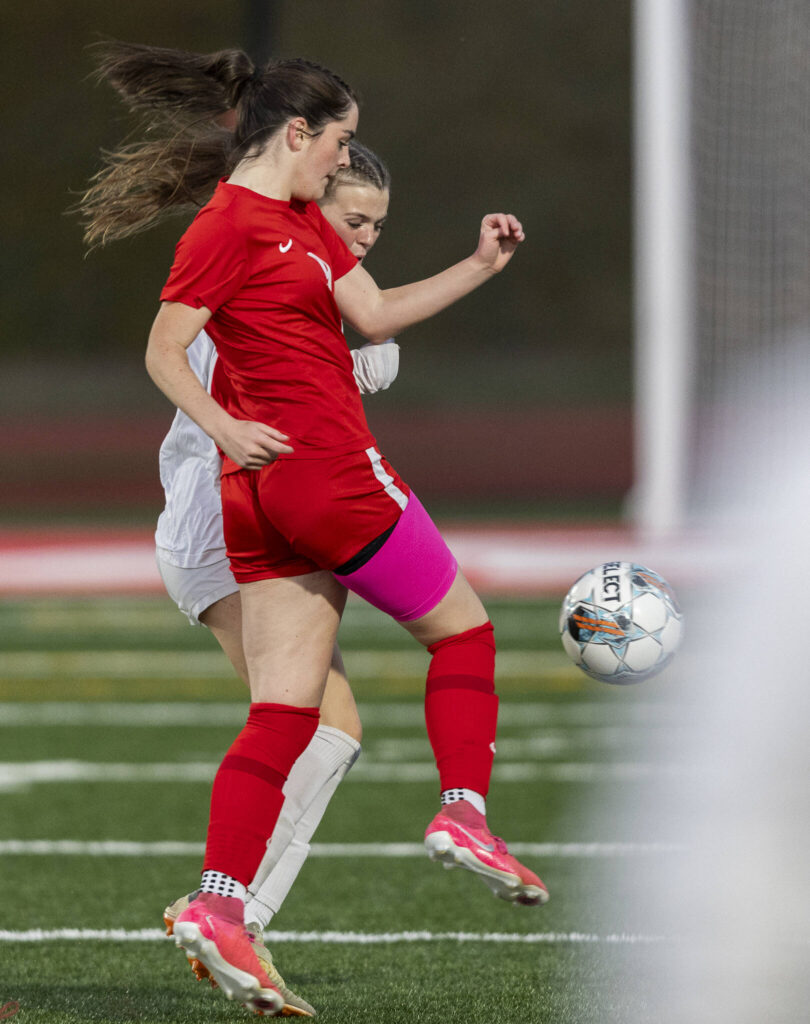 Stanwood&rsquo;s Kendall Rhodes kicks the ball downfield past Snohomish&rsquo;s Halle Long during the game against Snohomish on Sept. 25, 2025 in Stanwood, Washington. (Olivia Vanni / The Herald)

