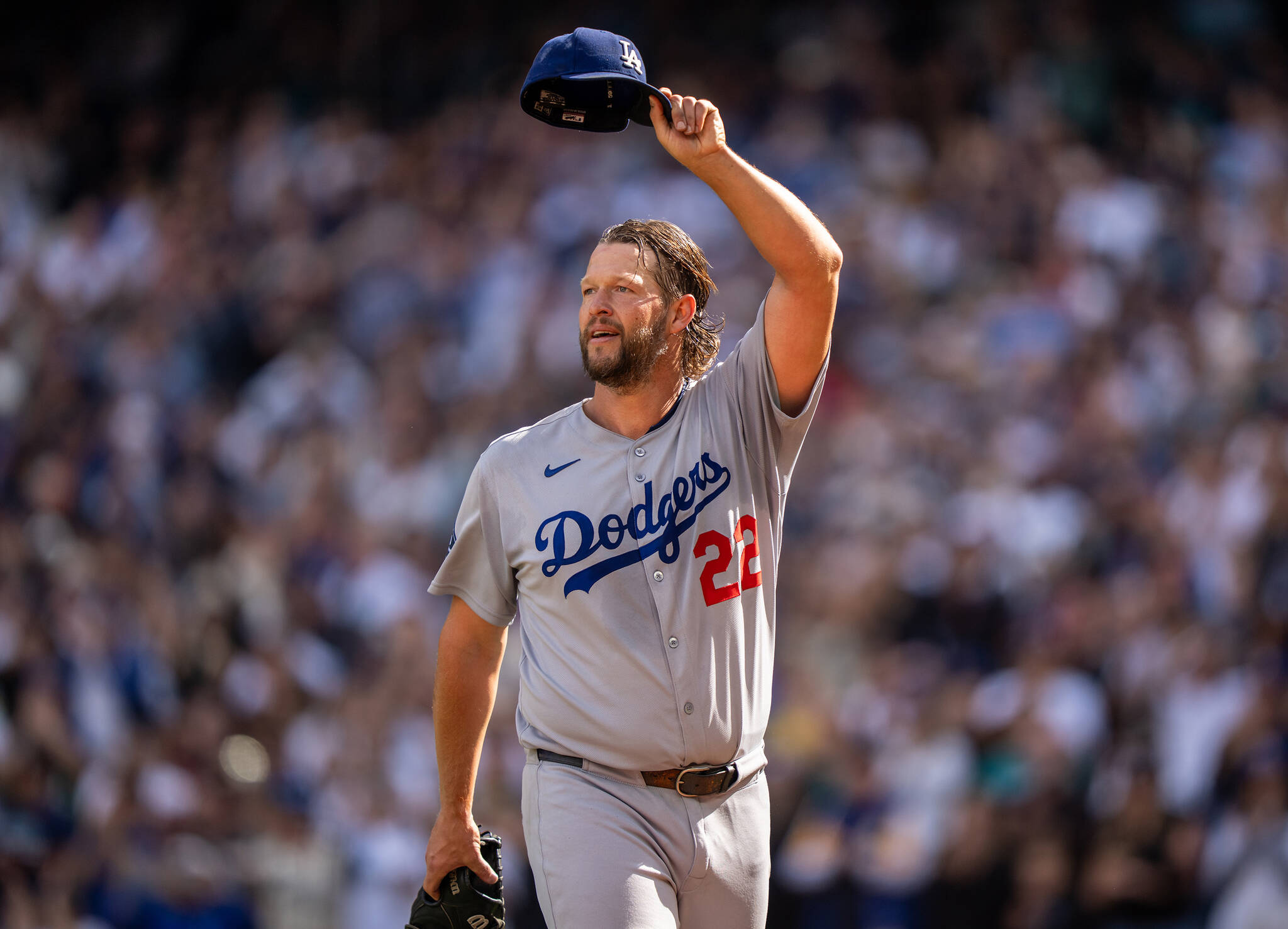 Starting pitcher Clayton Kershaw (22) of the Los Angeles Dodgers acknowledges fans as he walks off the field during the sixth inning of a game against the Seattle Mariners at T-Mobile Park on Sunday, Sept. 28, 2025, in Seattle. (Stephen Brashear / Getty Images/ Tribune News Services)