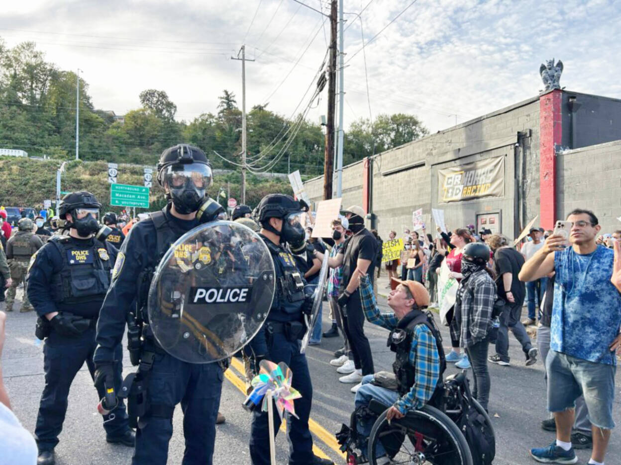 About 200 people showed up to protest outside the Immigration and Customs Enforcement building in Portland on Sunday, Sept. 28. (Photo by Alex Baumhardt/Oregon Capital Chronicle)