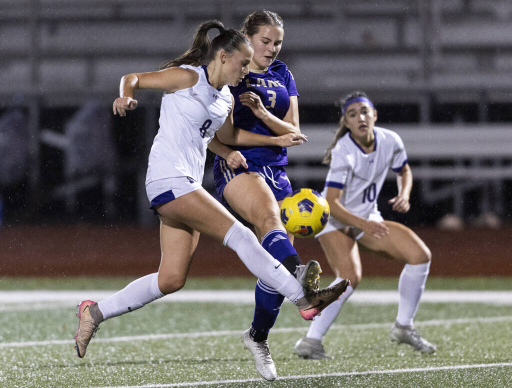 Kamiak’s Mia Velkova and Lake Stevens’ Cora Jones both jump in the air to try and gain possession during the game on Sept. 30, 2025 in Lake Stevens, Washington. (Olivia Vanni / The Herald)
