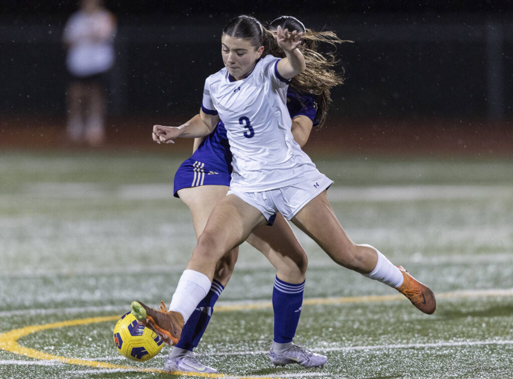 Kamiak’s Ella Henriksen tries to keep possession of the ball during the game against Lake Stevens on Sept. 30, 2025 in Lake Stevens, Washington. (Olivia Vanni / The Herald)
