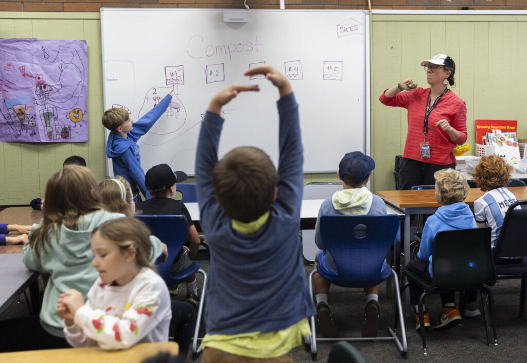 Blake Bishop helps explain the steps fellow students need to follow for class at South Whidbey Elementary School on Sept. 22, 2025 in Langley, Washington. (Olivia Vanni / The Herald)
