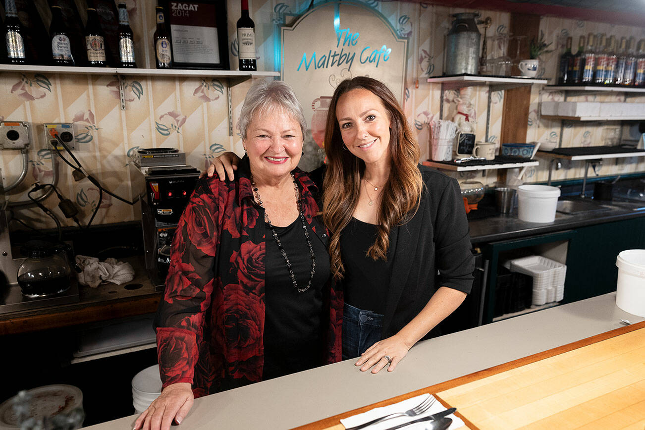 Keesha Laws, right, with mom and co-owner Tana Baumler, left, behind the bar top inside The Maltby Cafe on Sept. 29, 2025 in Snohomish, Washington. (Olivia Vanni / The Herald)