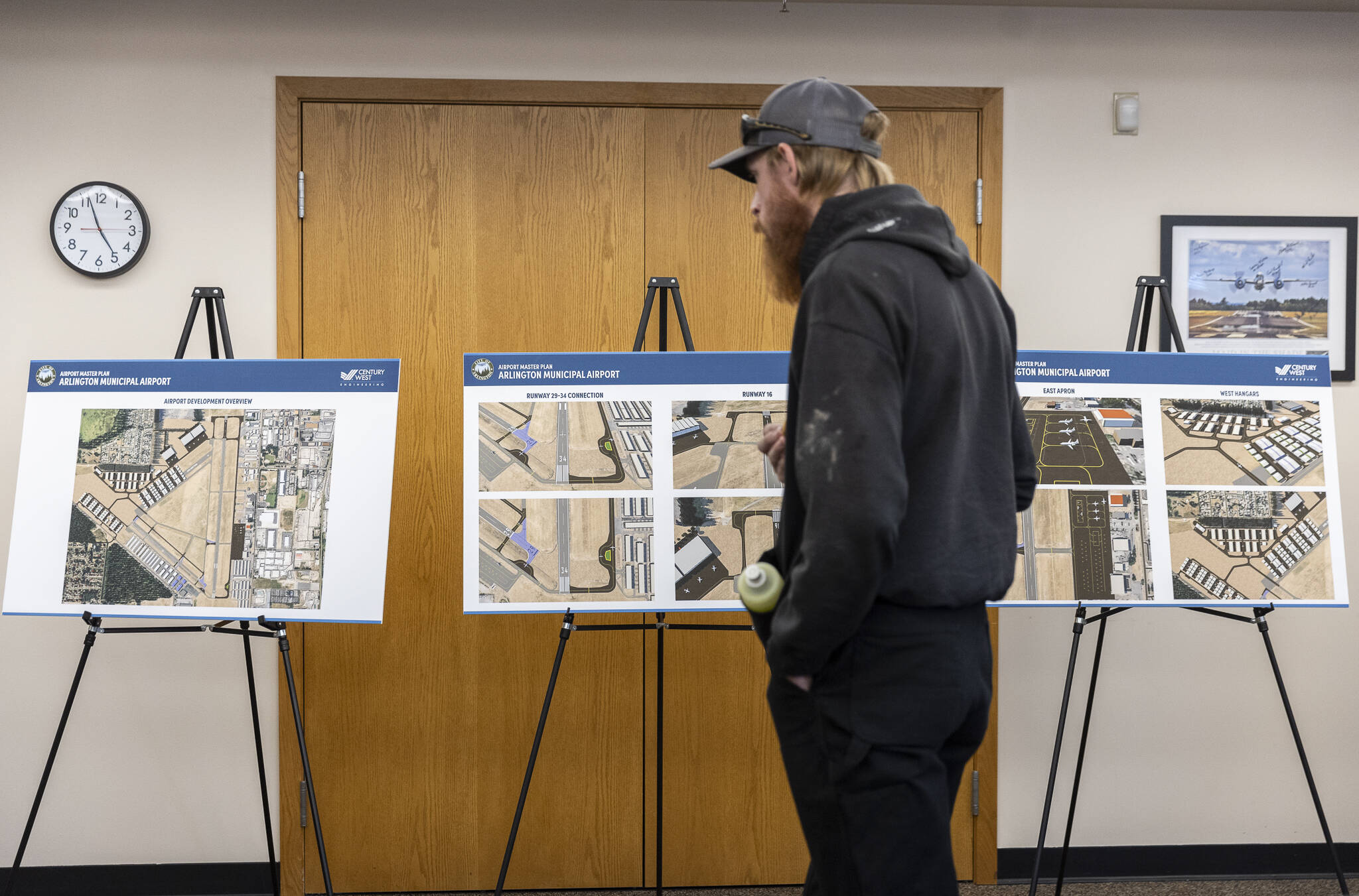 People looks at development plans for the Arlington Airport on Oct. 8, 2025 in Arlington, Washington. (Olivia Vanni / The Herald)