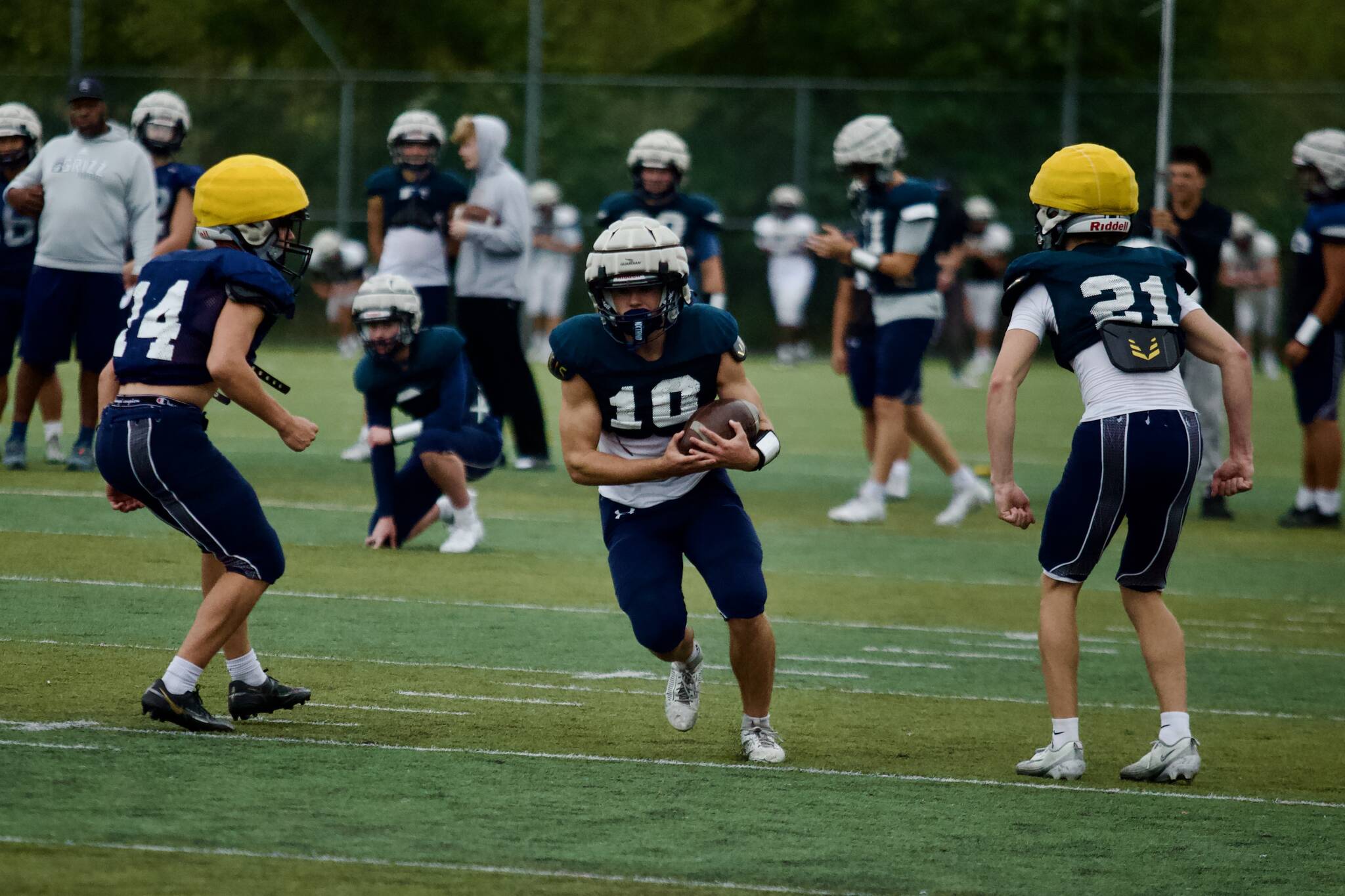 Glacier Peak senior Michael Darling (center) cuts down field after hauling in a reception during the Grizzlies' practice at Glacier Peak High School in Snohomish on Sept. 30, 2025. (Joe Pohoryles / The Herald)