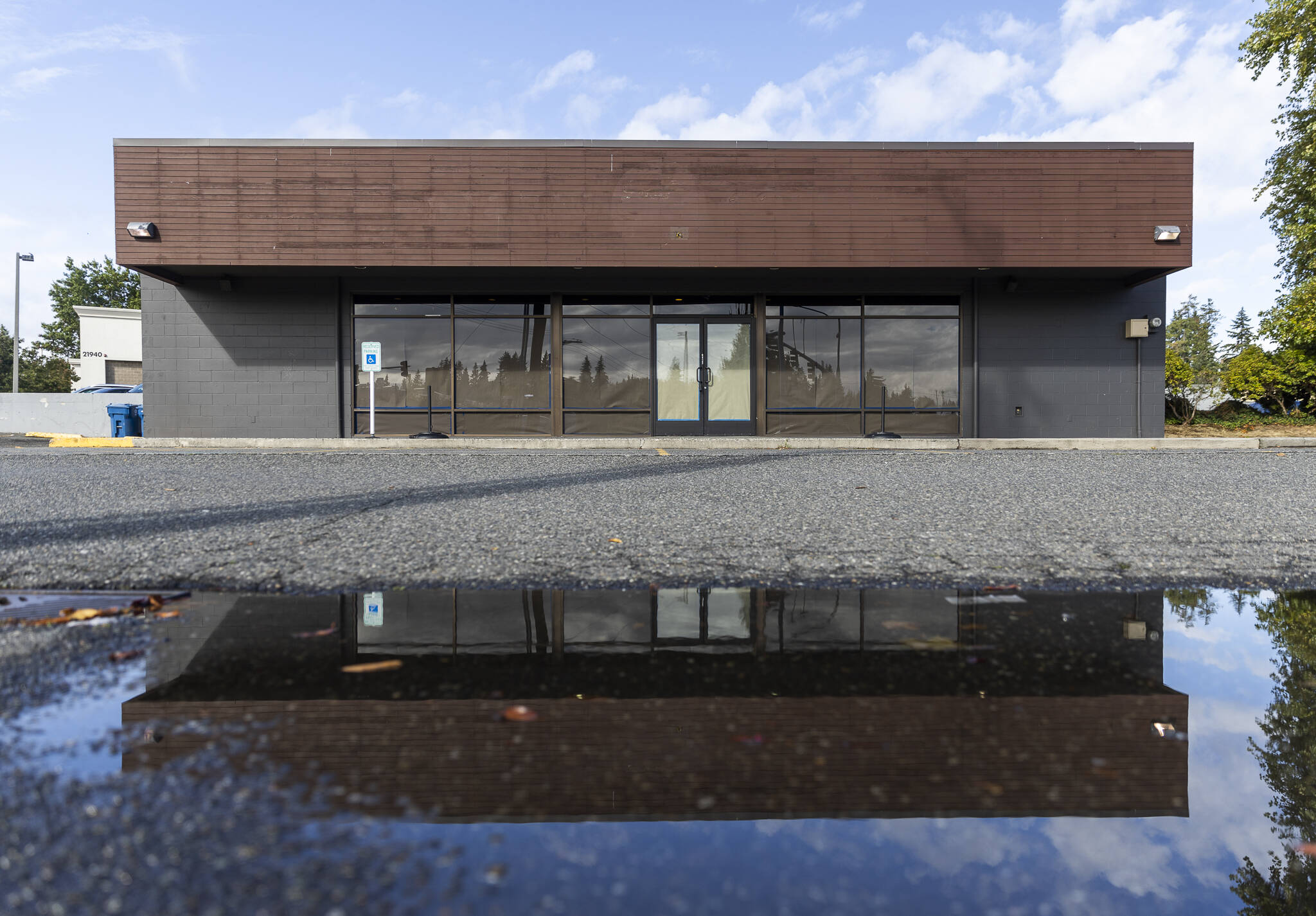 Paper covers the windows and doors of a recently closed Starbucks at the corner of Highway 99 and 220th Street SW on Oct. 1, 2025 in Edmonds, Washington. (Olivia Vanni / The Herald)