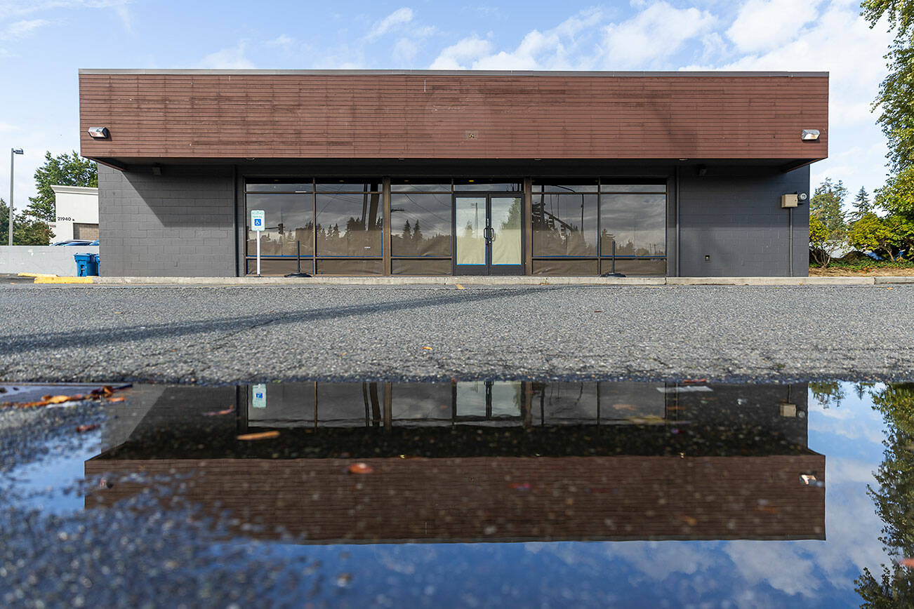 Paper covers the windows and doors of a recently closed Starbucks at the corner of Highway 99 and 220th Street SW on Oct. 1, 2025 in Edmonds, Washington. (Olivia Vanni / The Herald)