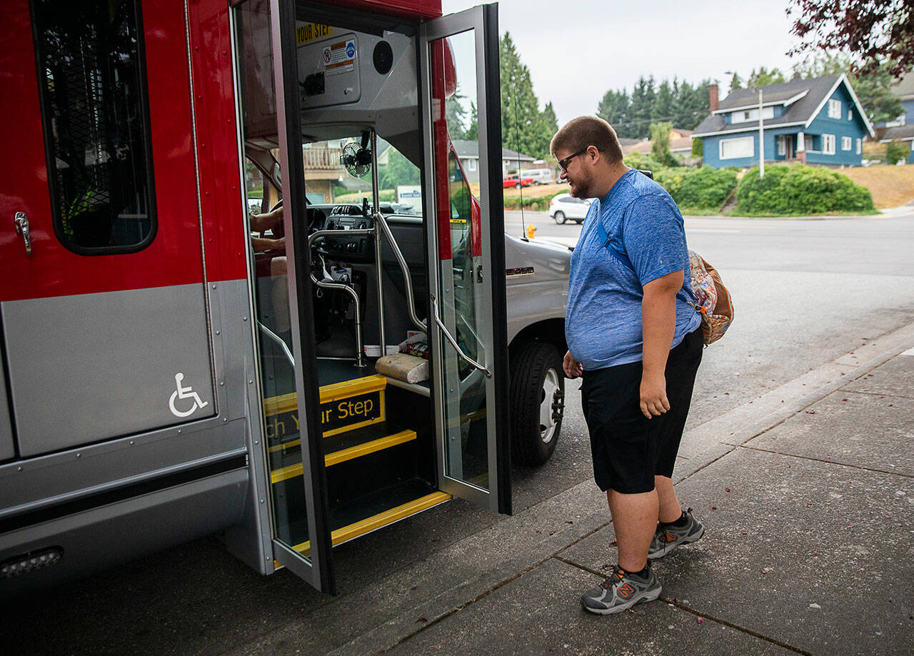 Doug Wennerberg boards the ParaTranist bus on Thursday, Sept. 1, 2022, in Everett, Washington. 
Olivia Vanni / The Herald