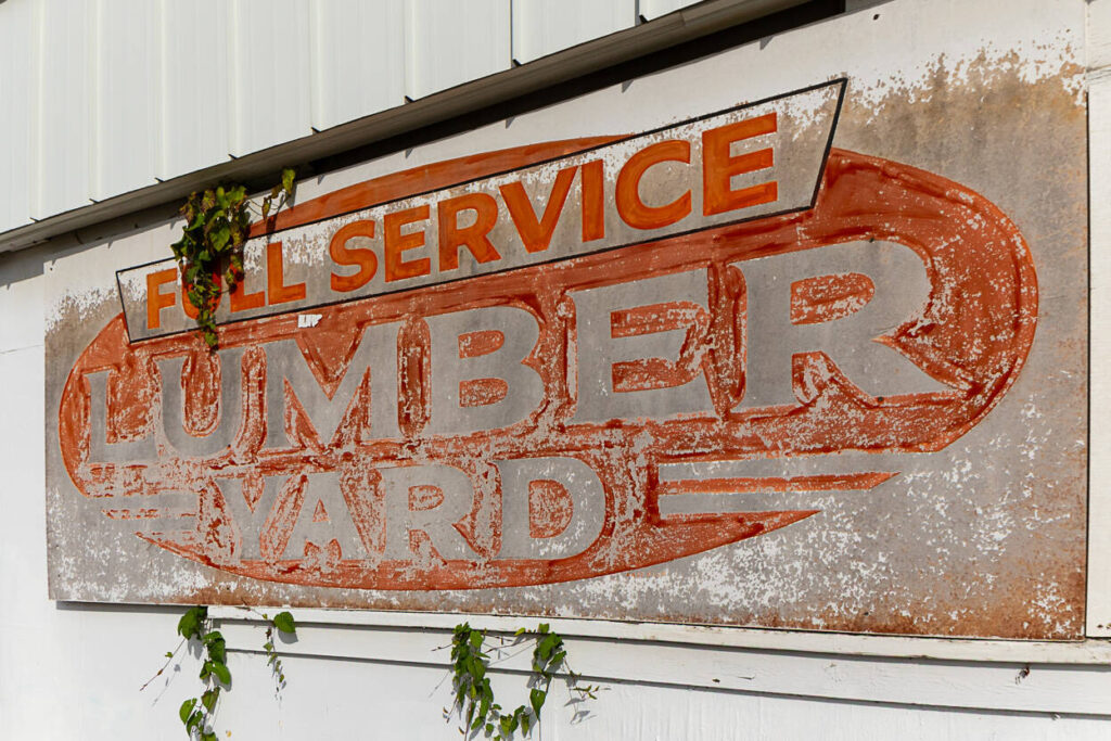 An old, faded sign is displayed on the south side of Martin Lumber & Hardware in Everett. (Aaron Kennedy / The Herald)
