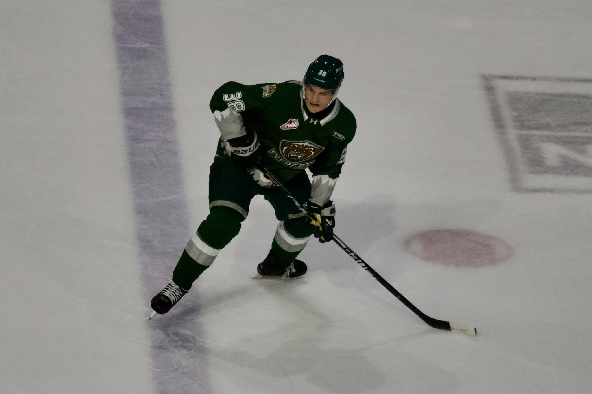 Silvertips forward Shea Busch looks to receive a pass before heading up ice during Everetts 9-4 win against Victoria at Angel of the Winds Arena on Oct. 4, 2025. Busch had a hat trick and two assists in the win. (Joe Pohoryles / The Herald)