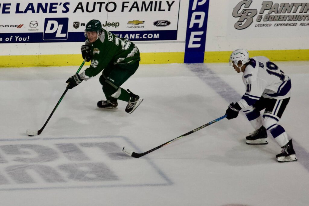 Silvertips forward Jesse Heslop (left) pushes through the neutral zone during Everett’s 9-4 win against Victoria at Angel of the Winds Arena on Oct. 4, 2025. (Joe Pohoryles / The Herald)
