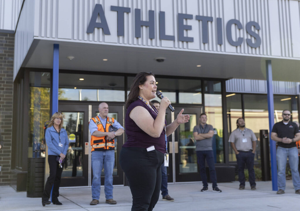 Explorer Middle School Principal Kendrah Leone speaks speak before a tour of the new athletics building on Oct. 7, 2025 in Everett, Washington. (Olivia Vanni / The Herald)
