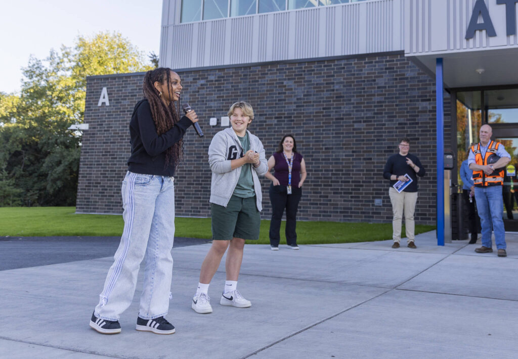 People walk through the Explorer Middle School locker rooms in their new athletics building on Oct. 7, 2025 in Everett, Washington. (Olivia Vanni / The Herald)
