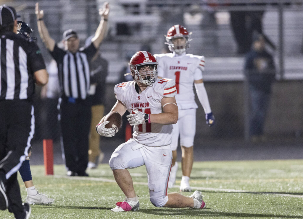 Stanwood’s Silas Turpin reacts to scoring a touchdown during the game against Arlington on Oct. 10, 2025 in Arlington, Washington. (Olivia Vanni / The Herald)
