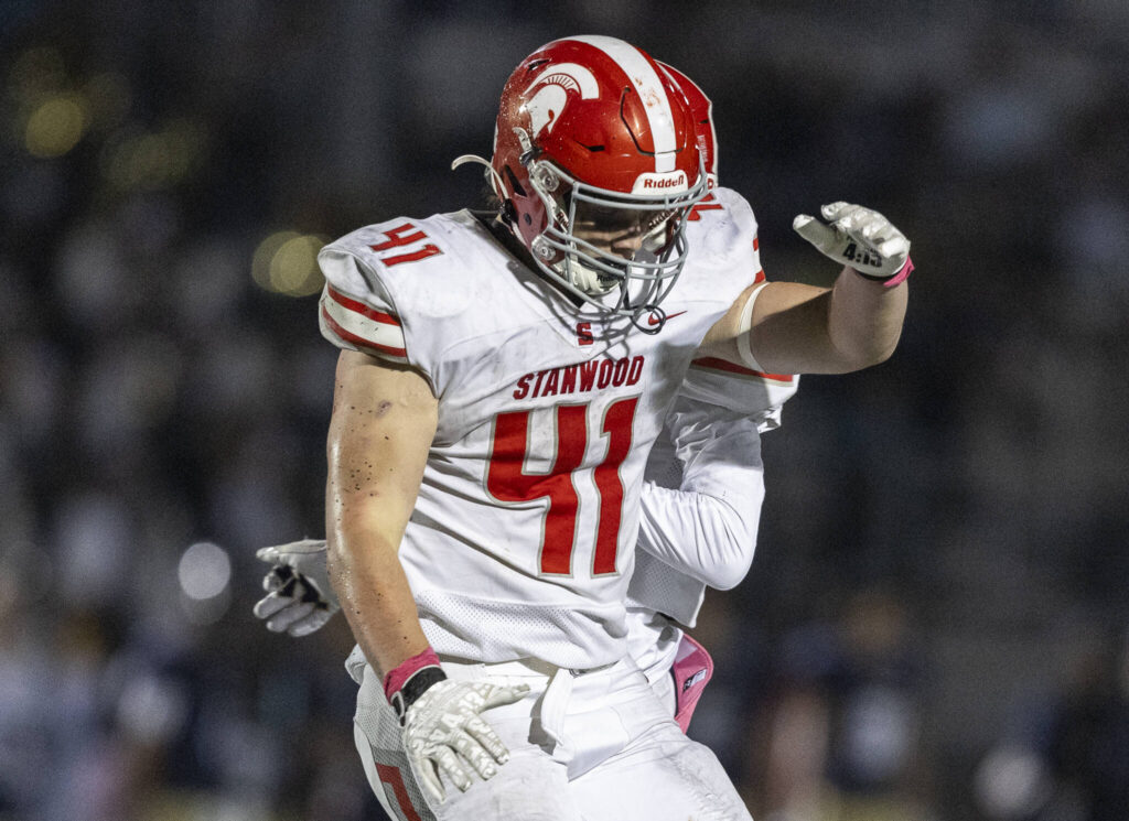 Stanwood’s Silas Turpin celebrates scoring a touchdown during the game against Arlington on Oct. 10, 2025 in Arlington, Washington. (Olivia Vanni / The Herald)
