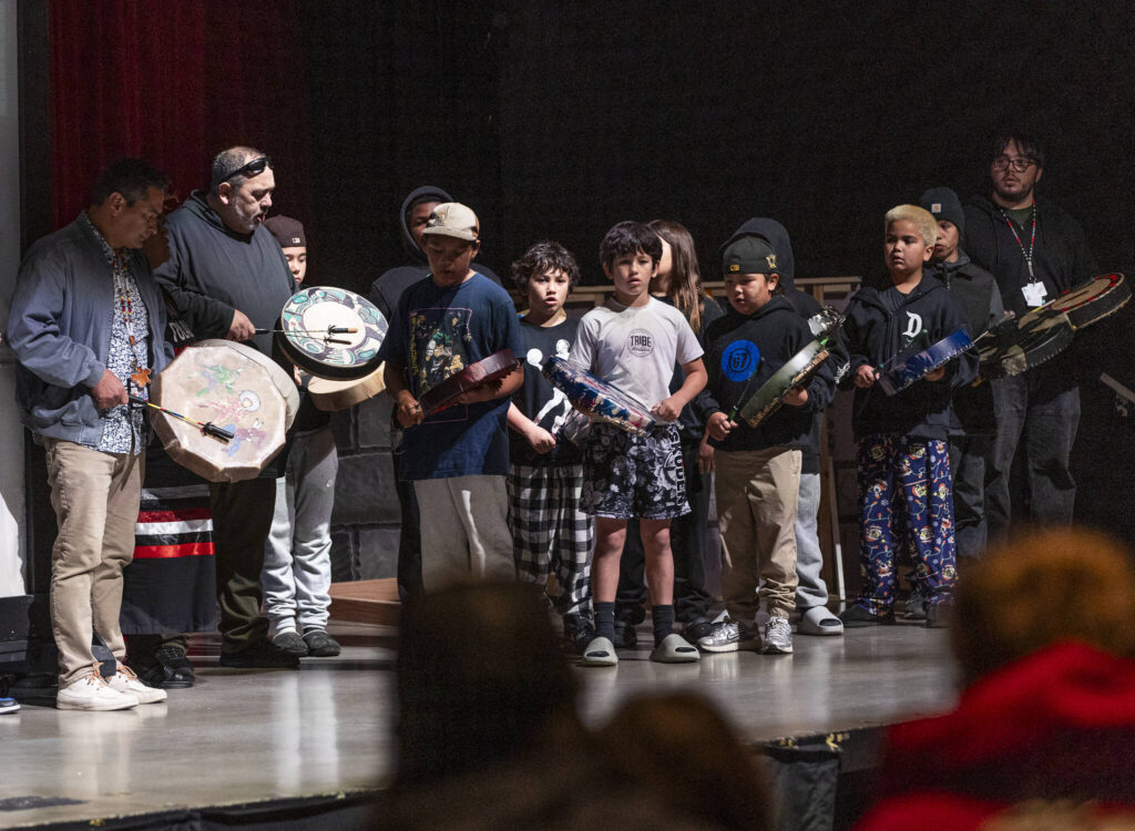Students from Quil Ceda Tulalip Elementary drum at a mural reveal event at Marysville Pilchuck High School on Oct. 14, 2025 in Marysville, Washington. (Olivia Vanni / The Herald)
