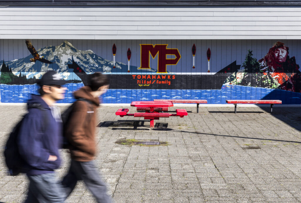 Students walk by a new mural on the Marysville Pilchuck High School campus on Oct. 14, 2025 in Marysville, Washington. (Olivia Vanni / The Herald)
