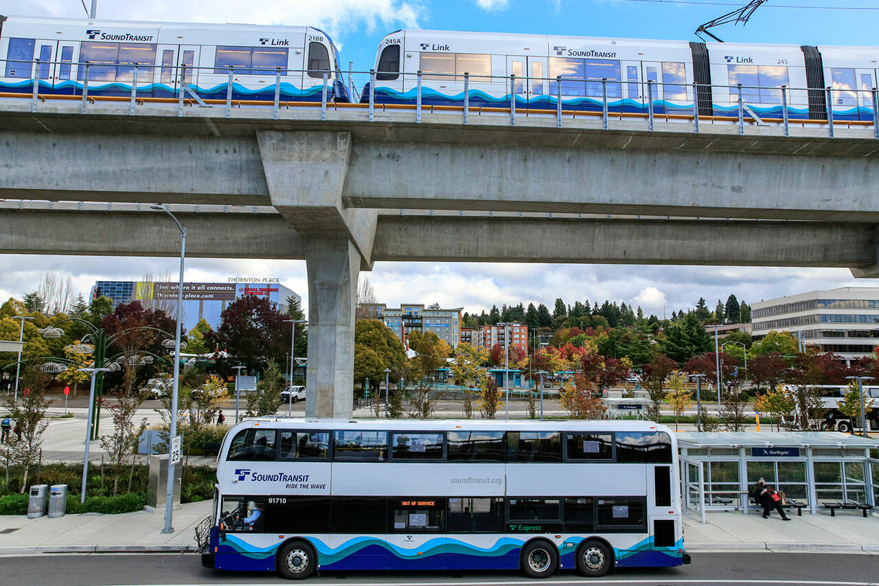 A Sound Transit bus at its stop in the shadow of the Northgate Light Rail Station in 2021 in Seattle. (Kevin Clark / The Herald)