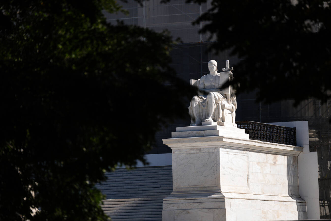 The marble statue depicting “The Authority of Law” is visible outside the Supreme Court in Washington on Monday, Oct. 6, 2025. President Donald Trump’s policies will have an even more central role in the Supreme Court term that begins on Monday. (Tierney L. Cross/The New York Times)