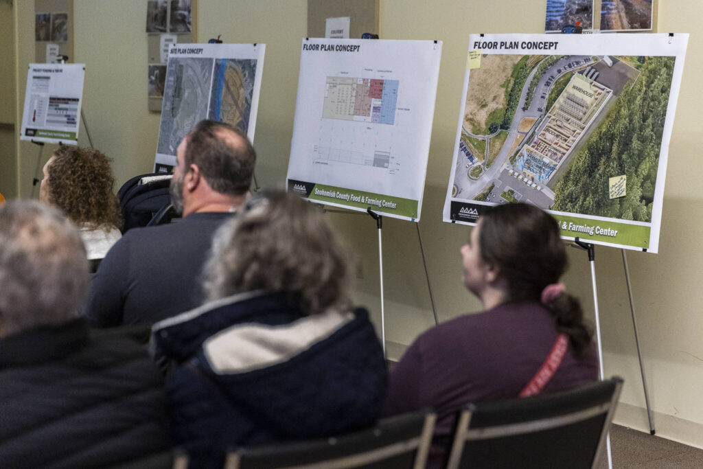 Concept art and informational board at an open house on Oct. 9, 2025 in Everett, Washington. (Olivia Vanni / The Herald)

