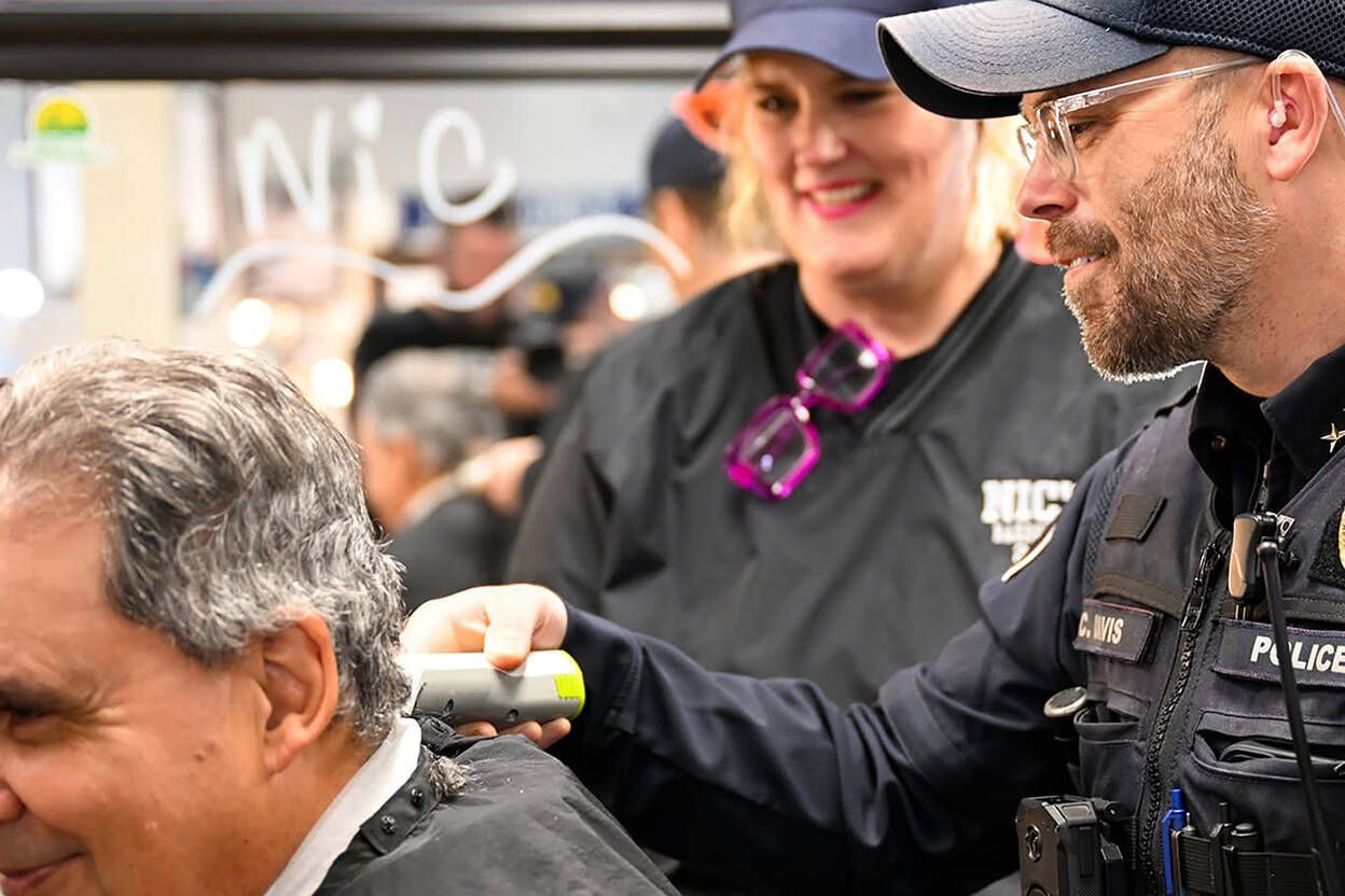 The annual Cuts with Cops event will return to Nic’s Barbershop on November 1 in Mukilteo. Under the supervision of trained barbers, officers will cut attendees’ hair. (Carson Swink)